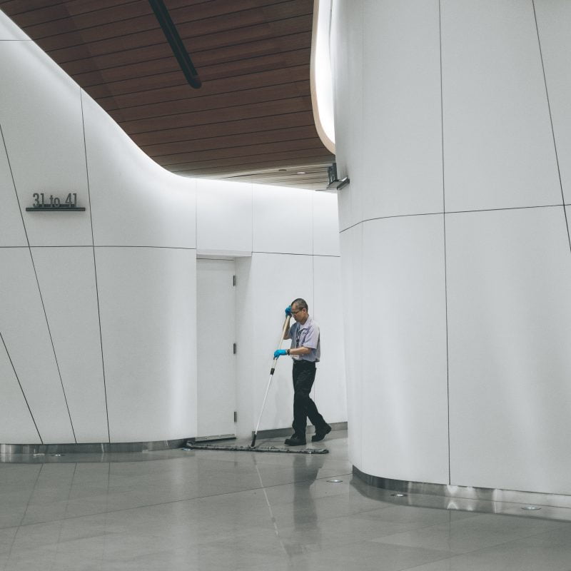 man mopping floor